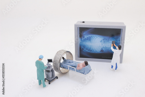 Miniature Scene Depicting an MRI Scan with Specialists Analyzing Results