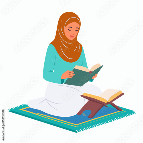 A Muslim woman in hijab reads the Quran while kneeling on a prayer rug