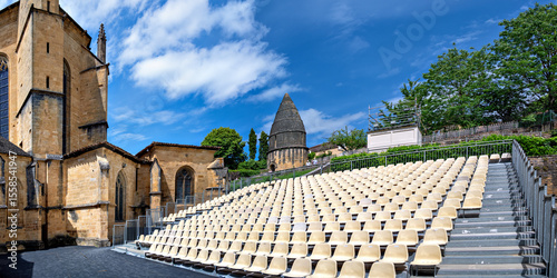 stand beside the cathedral of the Abbey of Saint-Sauveur und under the socalled lantern of the dead for the annual theatre festival in Sarlat-la-Canéda in the region Perigord, France