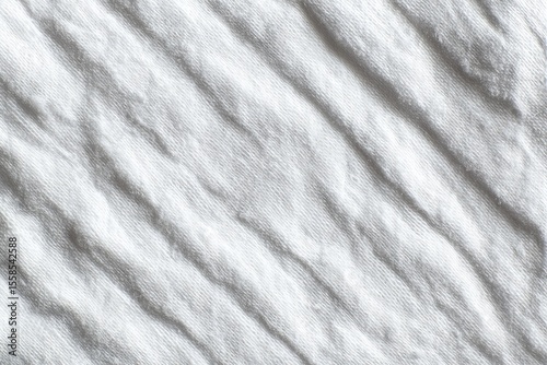 Wallpaper Mural Close-up view of a textured, white fabric.  Diagonal lines and folds create a subtle relief pattern Torontodigital.ca