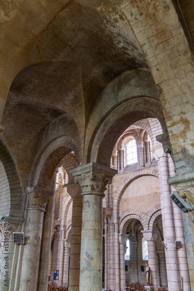 Fototapeta premium Romanesque arches and columns supporting the ceiling of Poitiers Cathedral in France