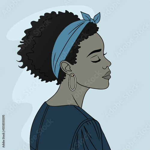 Stylish female portrait with natural afro hairstyle and headband expressing modern elegance and confidence
