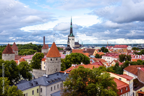 Wallpaper Mural Panoramic view of Tallinn Old Town from Patkuli platform, showcasing medieval stone towers, red rooftops, and the tall spire of St. Olaf’s Church, Estonia.

 Torontodigital.ca