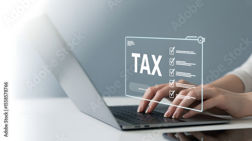 Person typing on laptop with digital tax form checklist displayed taxation finance