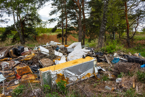 Unauthorized garbage dump in nature, illegal waste disposal