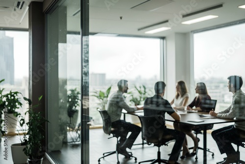 Business office with blurred people casual wear, blurred bokeh background during meeting