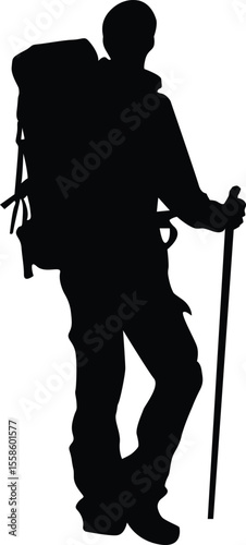 Silhouette of a hiker with a backpack and walking stick ready for an outdoor adventure