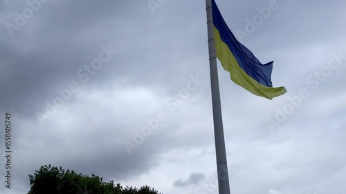 Ukraine flag waving on flagpole against sky