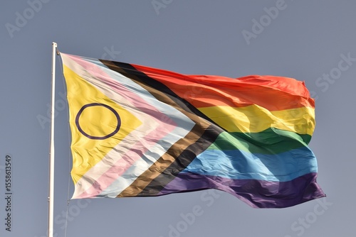Close‑up of the intersex‑inclusive Pride flag fluttering in sunlight, highlighting unity and acceptance