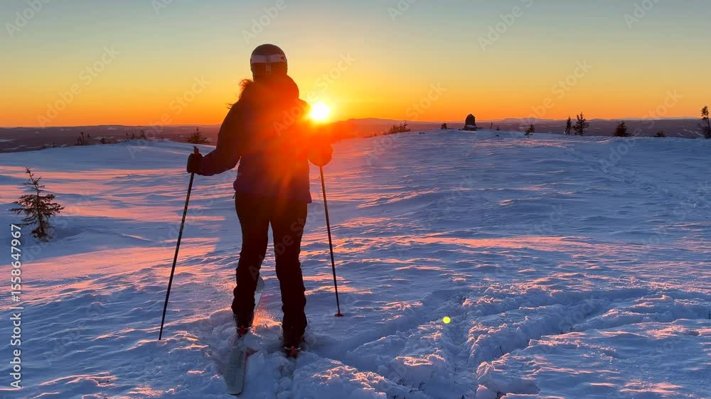 Norwegian winter sunset Telemark cross country ski skate turn Alpine skier skiing top of Hafjell Alpine resort Øyer mountain Norway Norge golden hour Lillehammer frigid frozen cold winter powder snow
