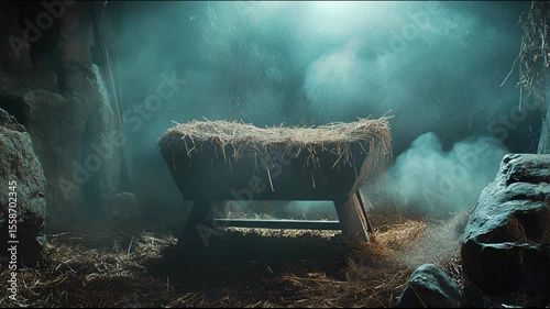 A rustic wooden manger filled with straw in a dimly lit stable, evoking themes of Christmas, birth, and biblical history.
