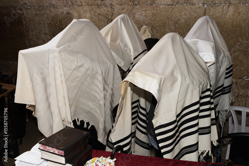 Cohanim or Jewish priests cover their heads with their prayer shawls and recite a special blessing for God's protection of  the Jewish people.