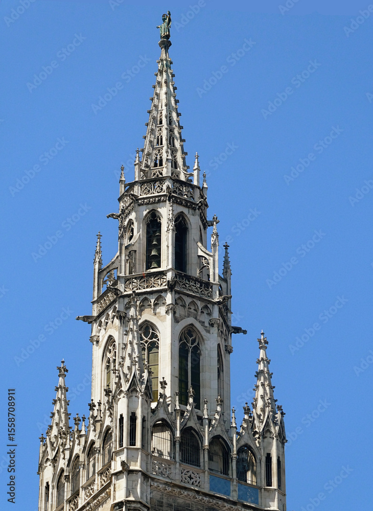 Fototapeta premium Munich - the top of the gothic tower of the New City Hall in Marienplatz