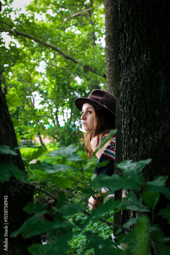A girl's outfit styled after the indigenous peoples of the world. International Day of the World's Indigenous Peoples. Against the backdrop of nature.