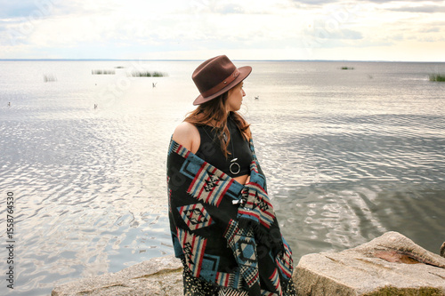 under the clothing of the world's indigenous peoples. International Day of the World's Indigenous Peoples. Against the backdrop of a lake