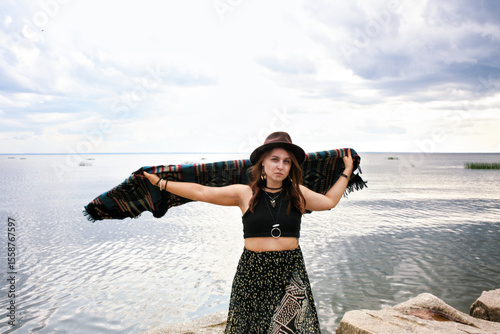 under the clothing of the world's indigenous peoples. International Day of the World's Indigenous Peoples. Against the backdrop of a lake