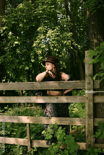 A girl's outfit styled after the indigenous peoples of the world. International Day of the World's Indigenous Peoples. Against the backdrop of nature.