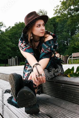 A girl's outfit styled after the indigenous peoples of the world. International Day of the World's Indigenous Peoples. Against the backdrop of nature.