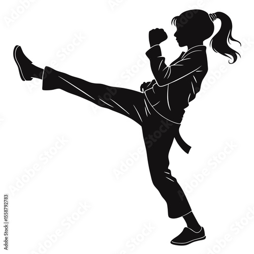 Powerful Silhouette: Girl Executing a Dynamic Martial Arts Kick