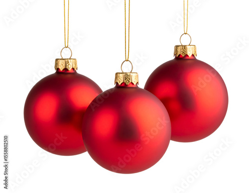 Elegant trio of matte red Christmas baubles gracefully suspended, evoking holiday spirit.
