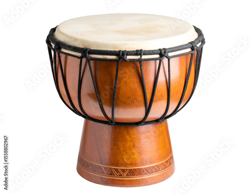 An intricately carved wooden djembe drum showcases its natural textures and musical craftsmanship