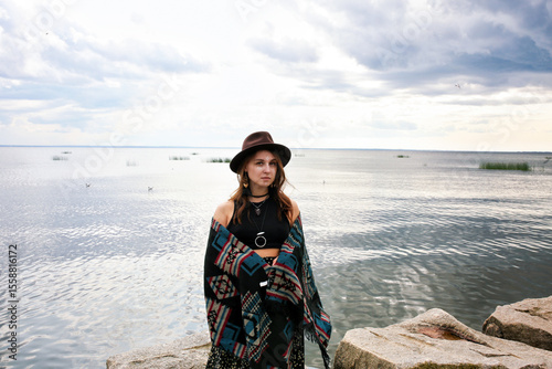 under the clothing of the world's indigenous peoples. International Day of the World's Indigenous Peoples. Against the backdrop of a lake