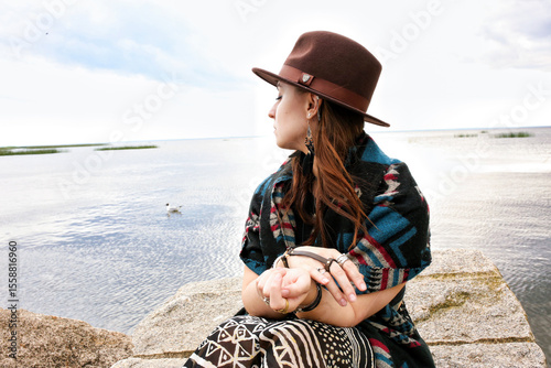 under the clothing of the world's indigenous peoples. International Day of the World's Indigenous Peoples. Against the backdrop of a lake