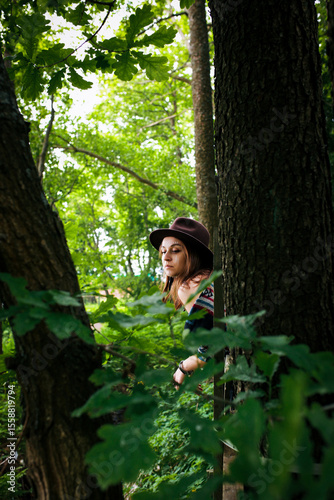 A girl's outfit styled after the indigenous peoples of the world. International Day of the World's Indigenous Peoples. Against the backdrop of nature.