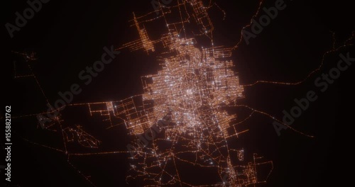 Mazar-i-Sharif (Afghanistan) top view at night. Aerial view on modern city with lights. Camera is flying above the city, moving backward. Vertical video. The north is on the left side