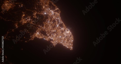 Salvador (Brazil) top view at night. Aerial view on modern city from space. Camera is flying above the city, moving forward. Vertical video. The north is on the left side