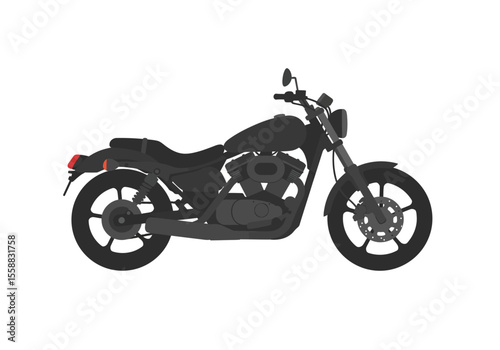 Gray motorcycle with a round headlight handlebars and a visible engine
