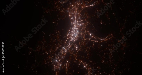 Quito (Ecuador) aerial view at night. Top view on modern city with glow effect. Camera is zooming out, rotating counterclockwise