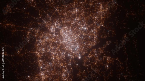 Turku (Finland) aerial view at night. Top view on modern city with street lights. Camera is zooming out, rotating clockwise. Vertical video. The north is on the left side