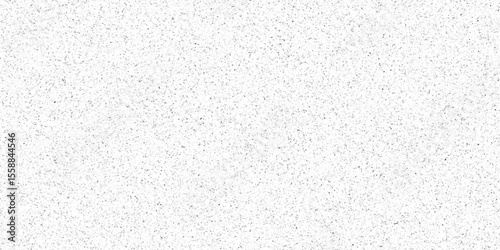 White terrazzo background with scattered gray and black dots. Rock spatter stone marble backdrop. Wall texture with noise overlay pattern. Vintage quartz terrazzo flooring.	