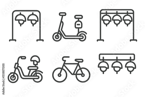 Bicycles and electric scooters on display at a parking area in an urban setting for alternative transportation