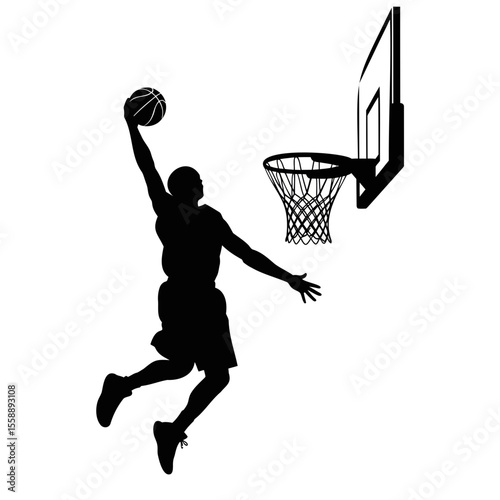 Silhouette of male basketball player dunking ball