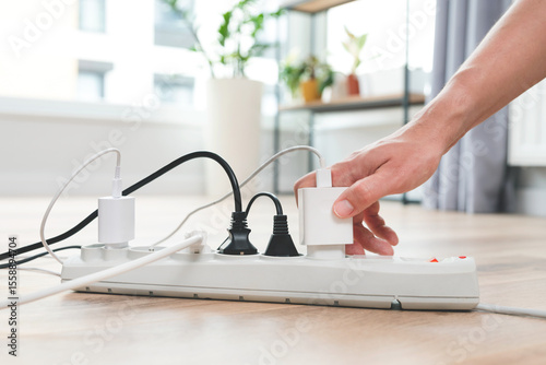 Power strip socket with connected plugs.