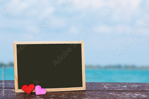 blank blackboard on wooden background. 