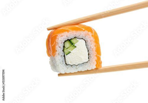 Fresh Philadelphia sushi roll with white rice, green cucumber, cream cheese, orange salmon, held by brown wooden chopsticks, suspended against a stark white background with copy space, commercial