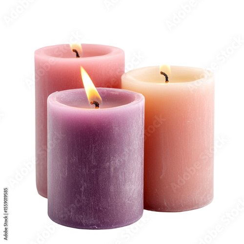 Three lit candles in pink purple and peach shades on black background