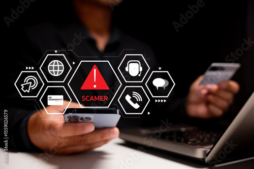 A person holding a credit card and smartphone, with a digital overlay warning of a scammer, highlighting online fraud and cybersecurity risks.