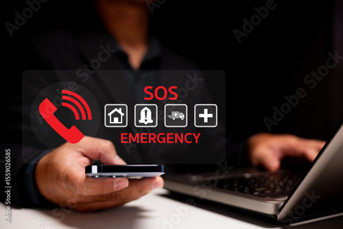 A person holding a smartphone near a laptop with an SOS emergency alert and icons for home, alarm, ambulance, and medical services displayed.