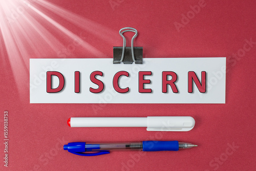 Discern text on paper on red background