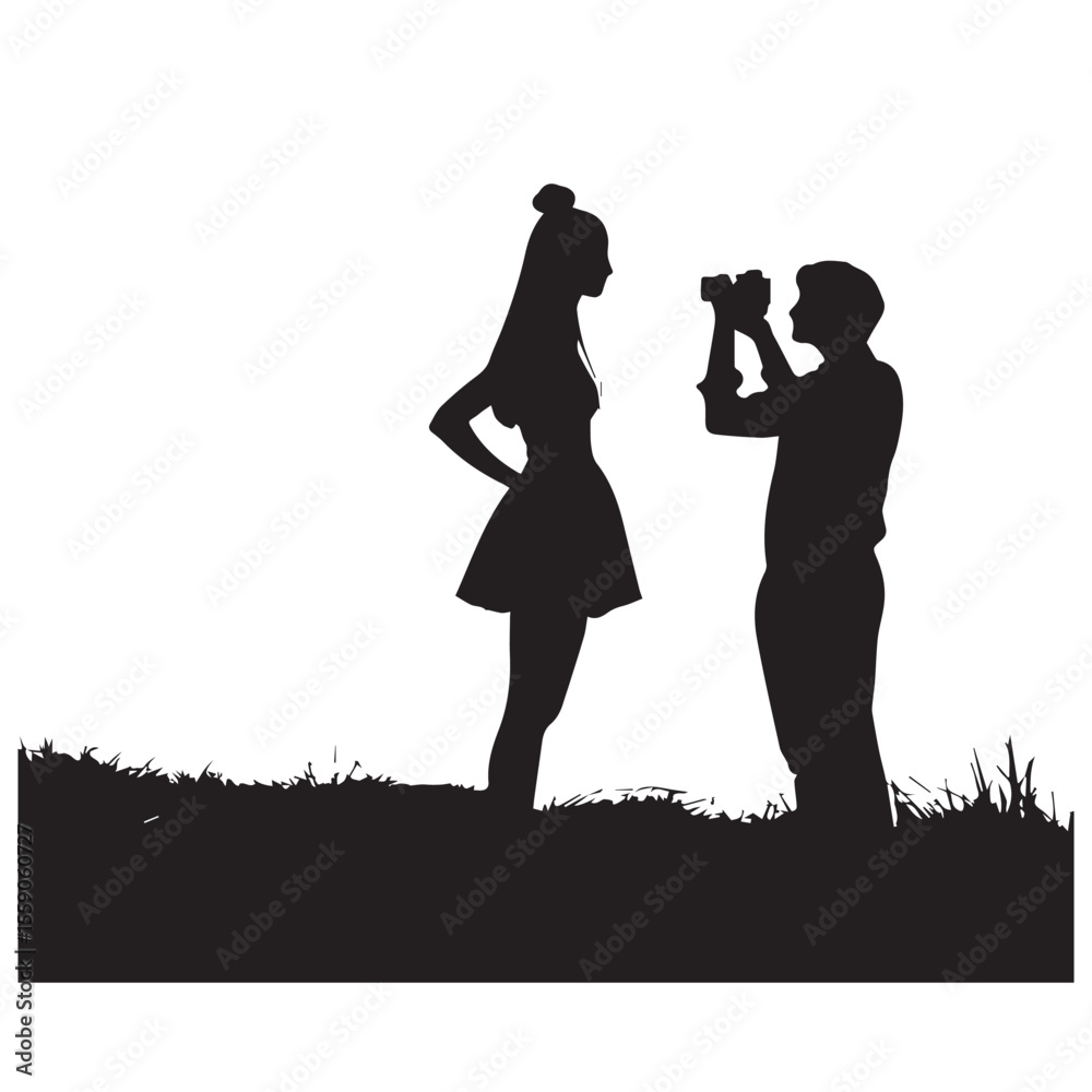Silhouette of a man taking a photo of a woman standing in grass Silhouette of a man taking a photo of a woman standing in grass