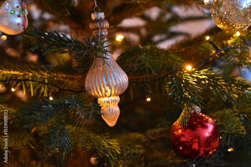Golden Teardrop Ornament on Decorated Tree