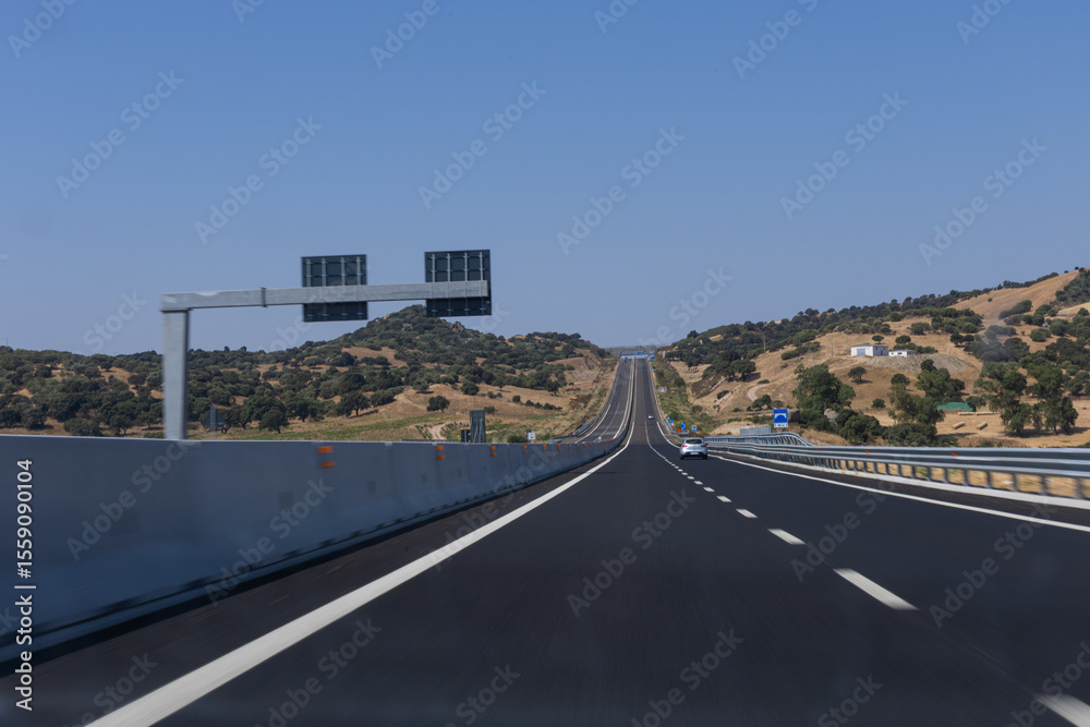 Fototapeta premium empty highway in Italy with a blue sky and clouds