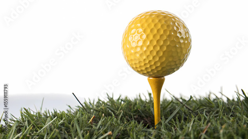 Yellow golf ball on tee in grass close up for golf equipment and sport golfing related stock images photos photo