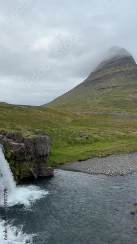 Majestic Kirkjufell mountain rising beside a cascading waterfall in western Iceland. A natural icon and one of the most photographed landscapes in the country.