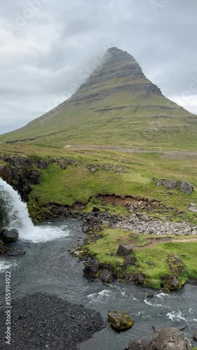 Kirkjufell mountain and waterfall in Grundarfjörður, Iceland. Famous filming location for Game of Thrones, known as Arrowhead Mountain. Iconic and photogenic landmark.