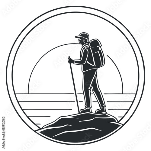 Adventurous hiker standing on a rocky peak overlooking a serene landscape at sunrise